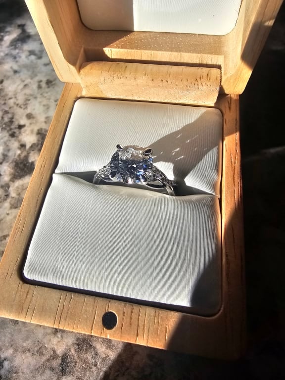 Oval diamond ring on hand
