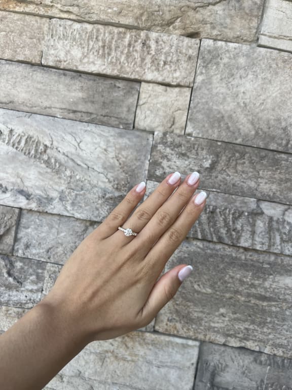 Oval diamond ring on hand