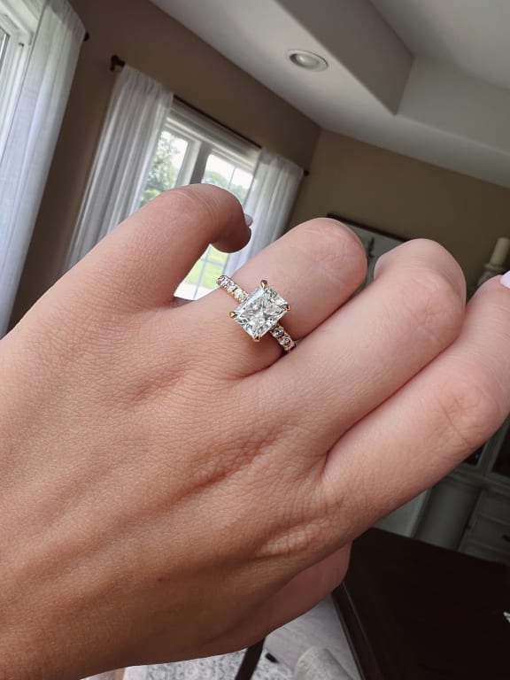 Oval diamond ring on hand