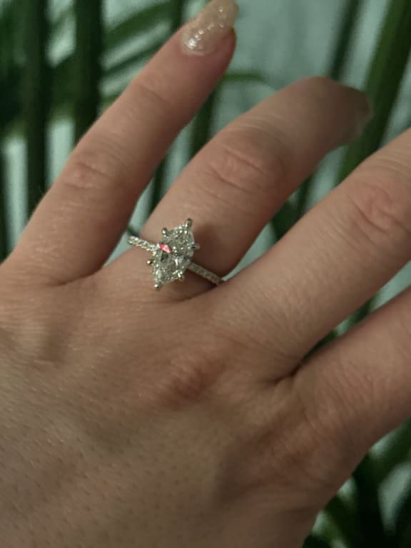 Oval diamond ring on hand