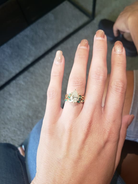 Oval diamond ring on hand