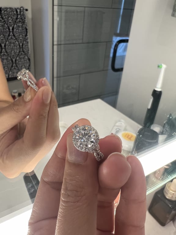 Oval diamond ring on hand