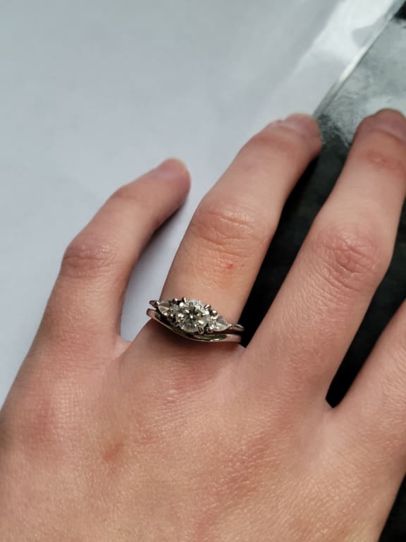Oval diamond ring on hand