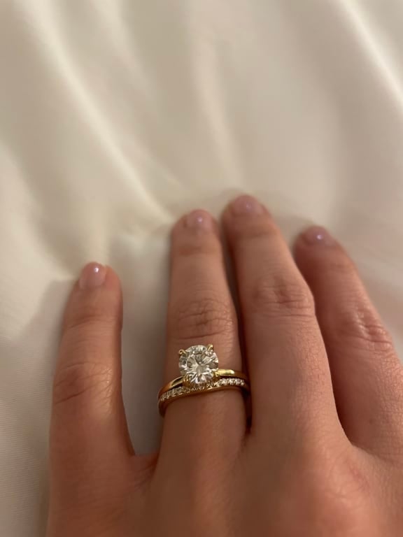 Oval diamond ring on hand