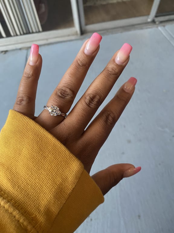 Oval diamond ring on hand