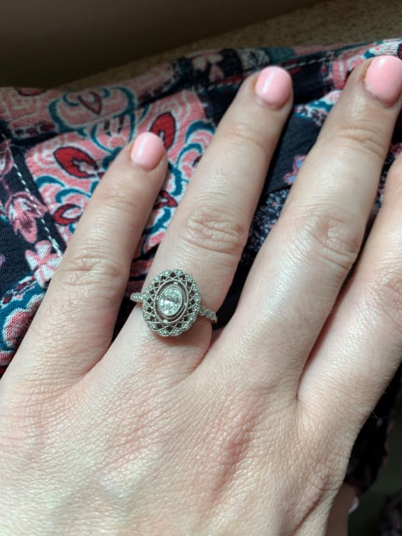 Oval diamond ring on hand