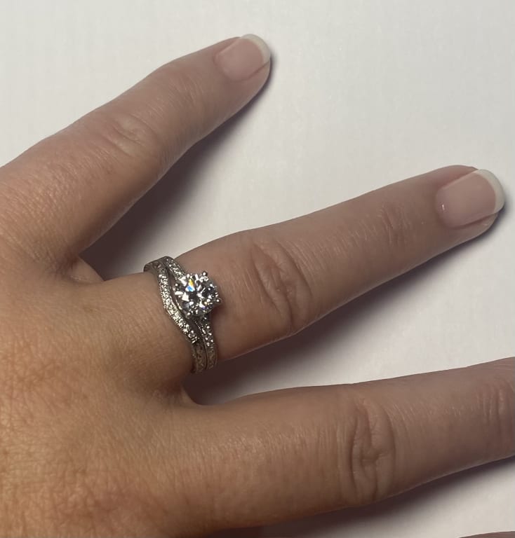 Oval diamond ring on hand