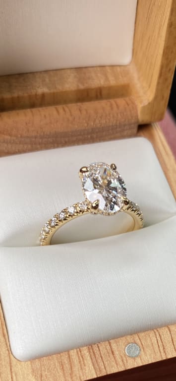 Oval diamond ring on hand