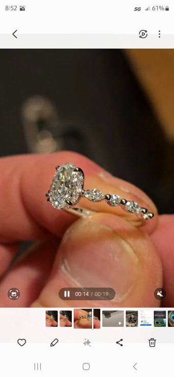 Oval diamond ring on hand