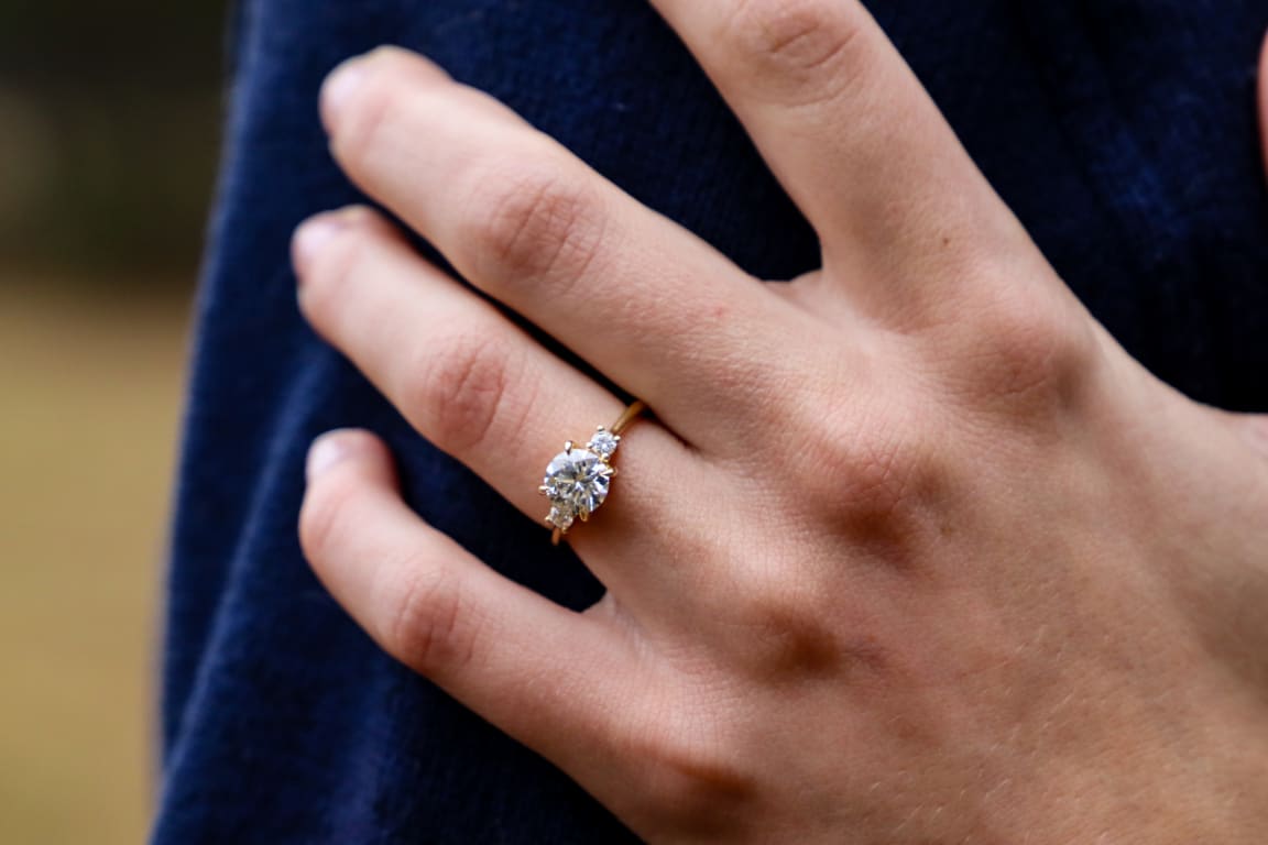 Oval diamond ring on hand