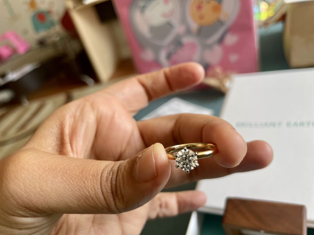 Oval diamond ring on hand