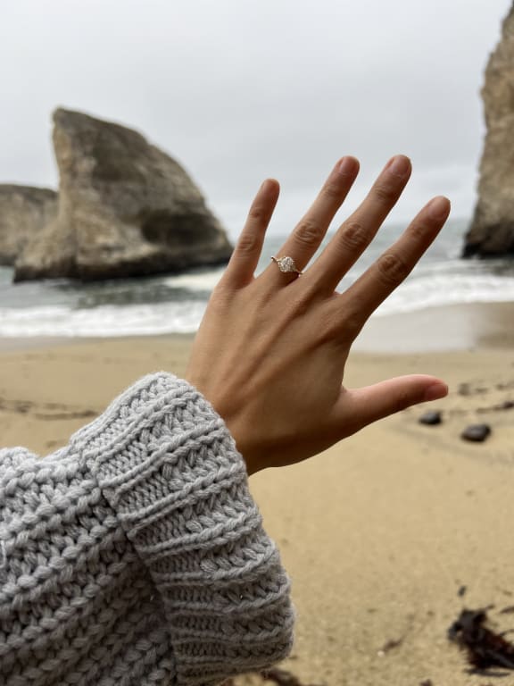 Oval diamond ring on hand