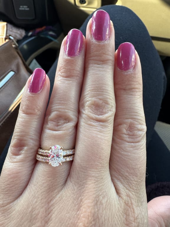 Oval diamond ring on hand