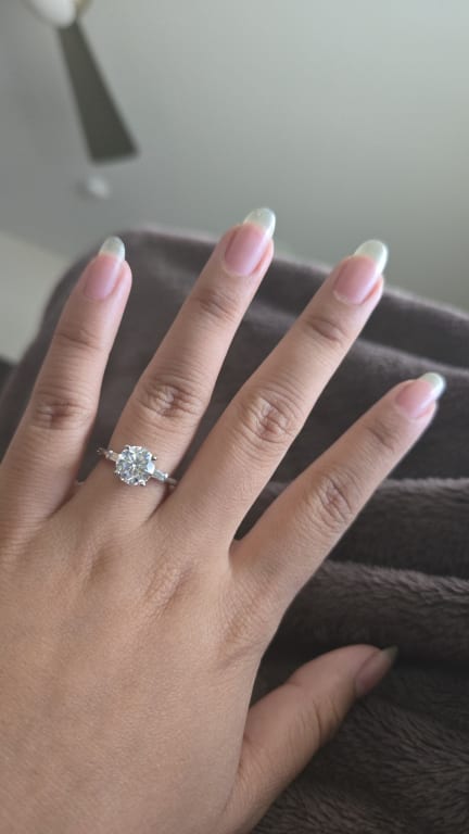 Oval diamond ring on hand