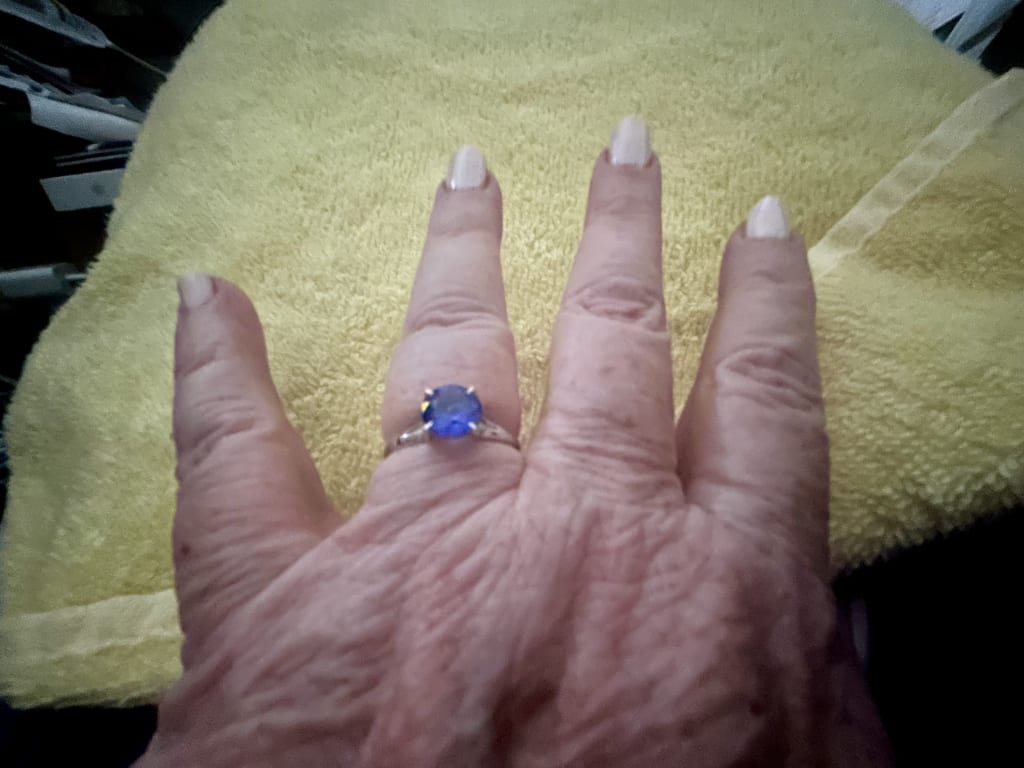 Oval diamond ring on hand