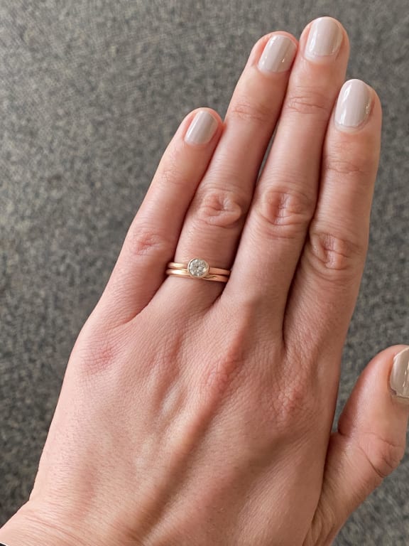 Oval diamond ring on hand