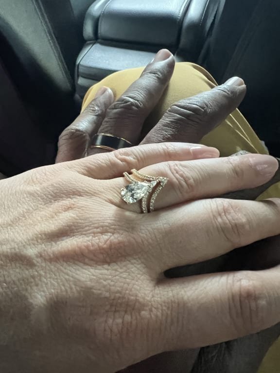 Oval diamond ring on hand