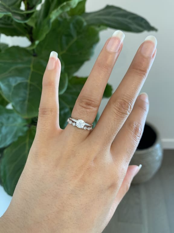 Oval diamond ring on hand