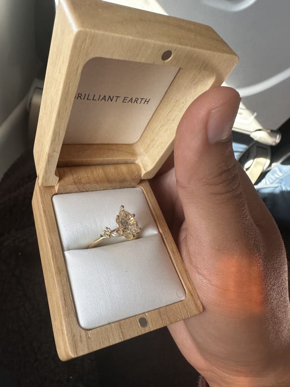 Oval diamond ring on hand
