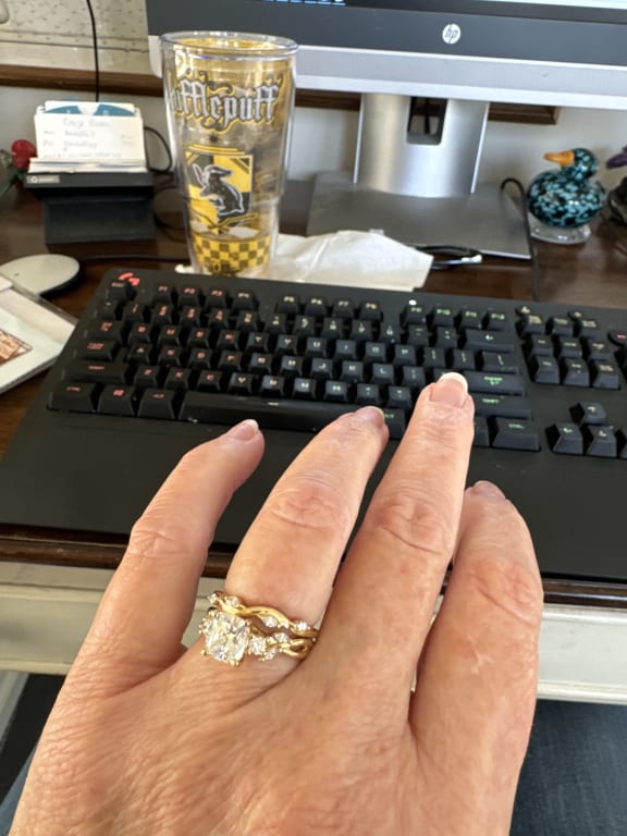 Oval diamond ring on hand