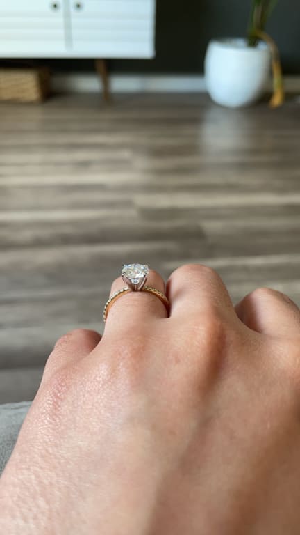 Oval diamond ring on hand