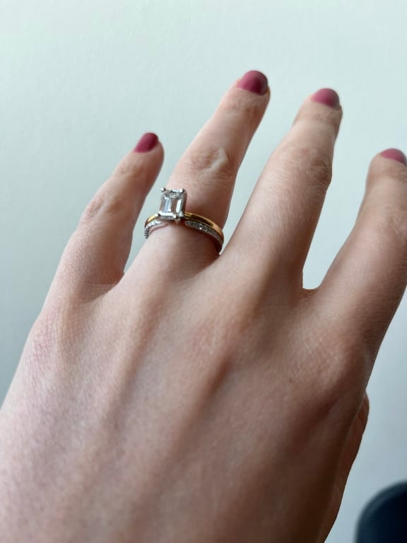 Oval diamond ring on hand