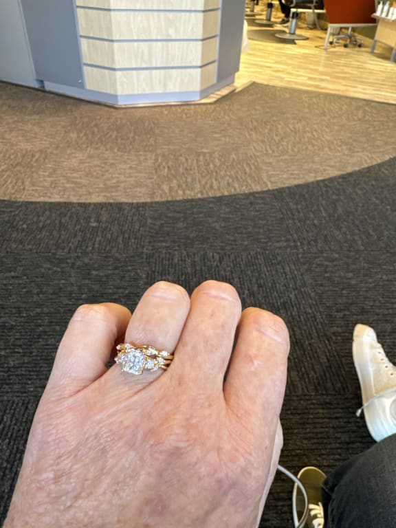 Oval diamond ring on hand