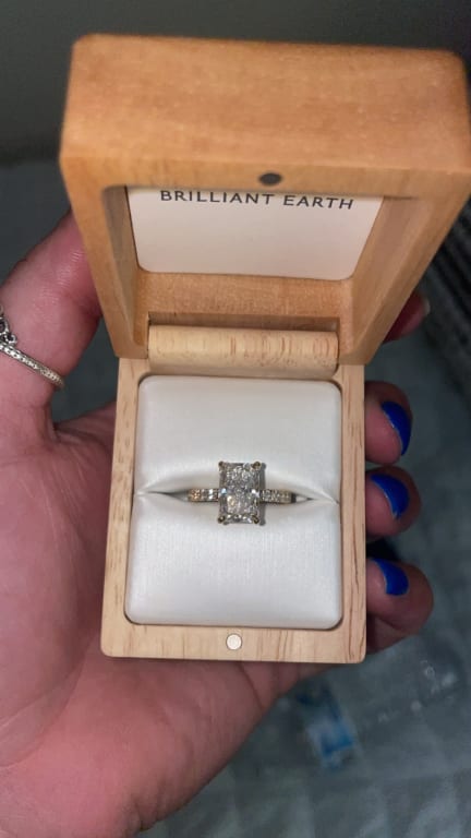 Oval diamond ring on hand