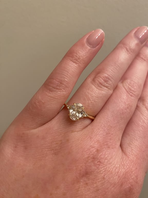 Oval diamond ring on hand