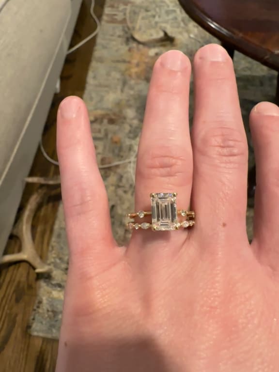 Oval diamond ring on hand