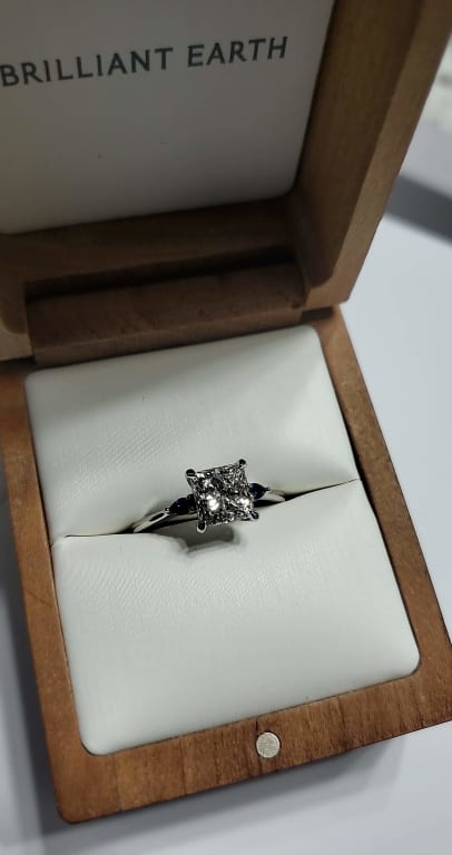 Oval diamond ring on hand