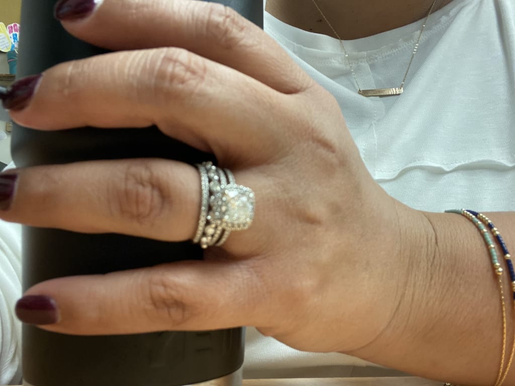 Oval diamond ring on hand