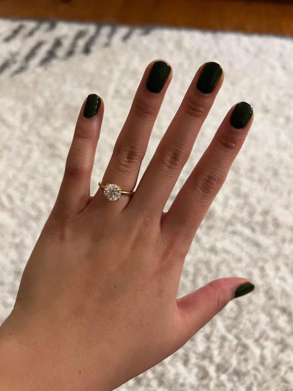 Oval diamond ring on hand