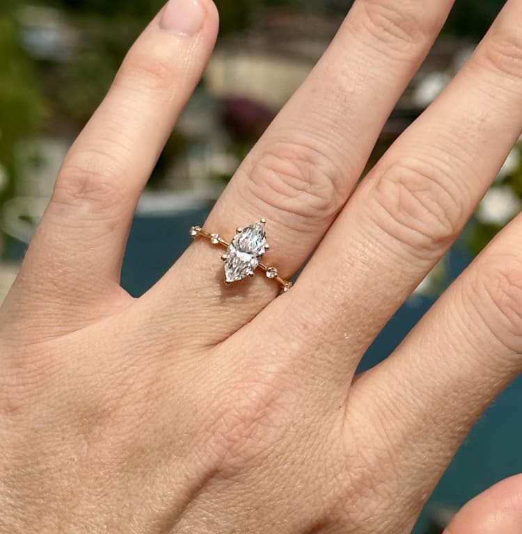 Oval diamond ring on hand