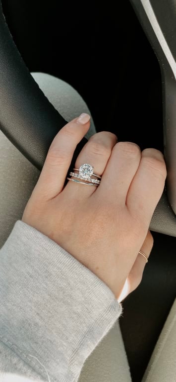 Oval diamond ring on hand
