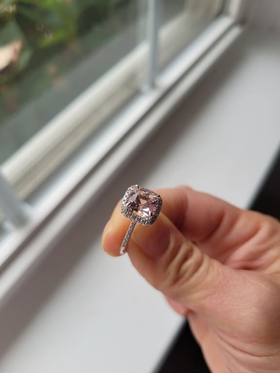 Oval diamond ring on hand