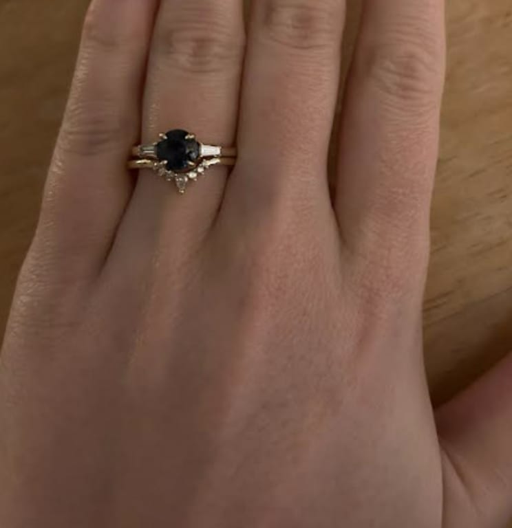 Oval diamond ring on hand