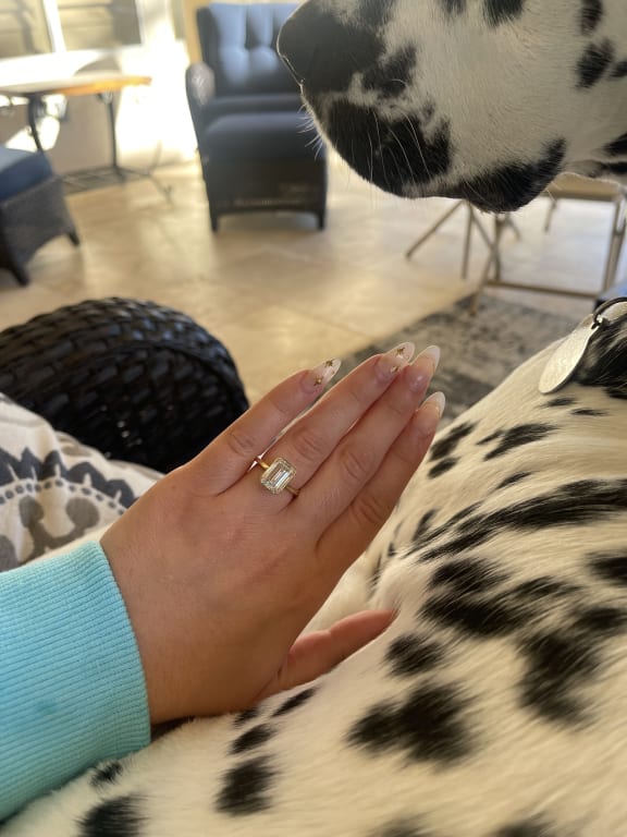 Oval diamond ring on hand