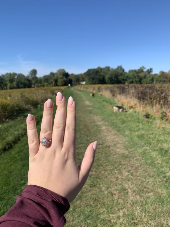 Oval diamond ring on hand
