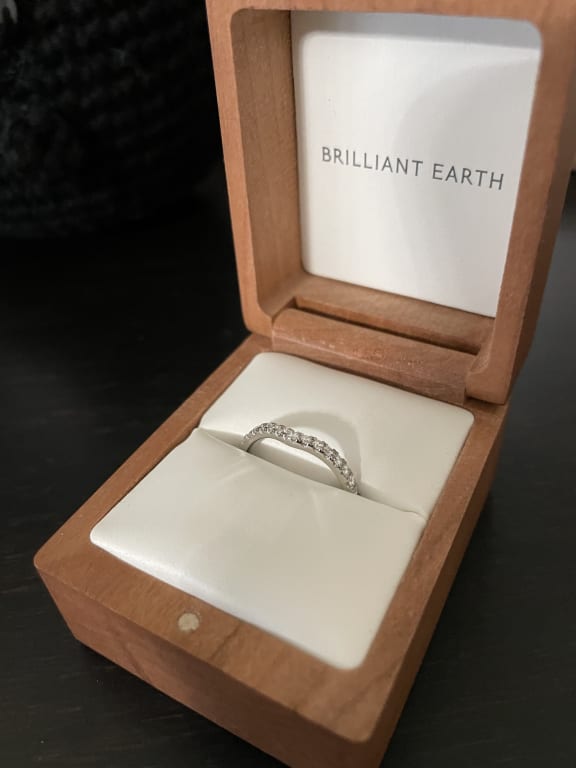 Oval diamond ring on hand