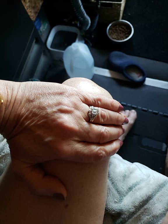 Oval diamond ring on hand