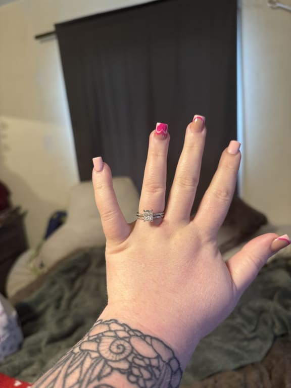 Oval diamond ring on hand