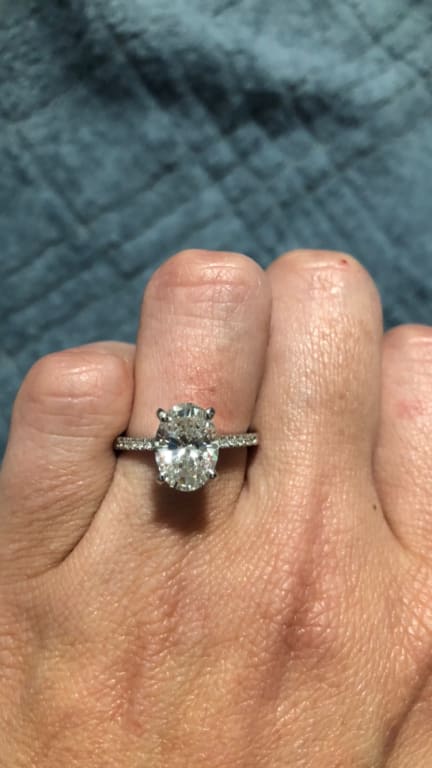 Oval diamond ring on hand