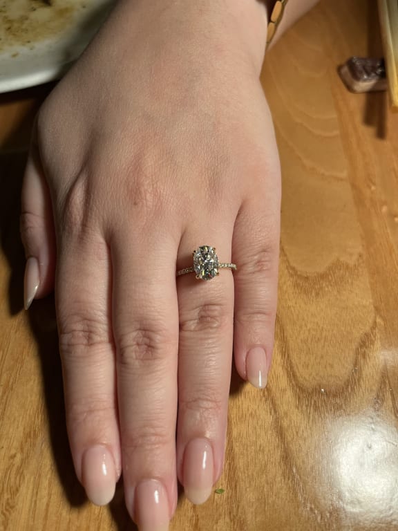 Oval diamond ring on hand