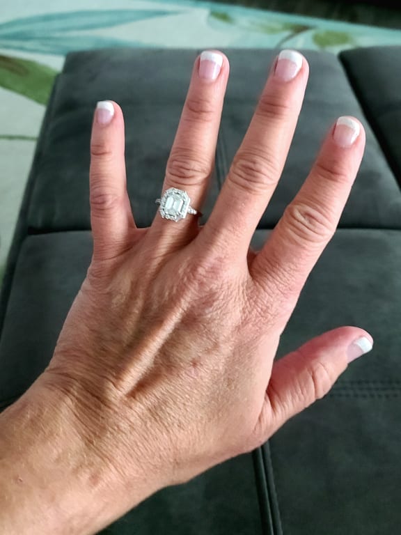 Oval diamond ring on hand