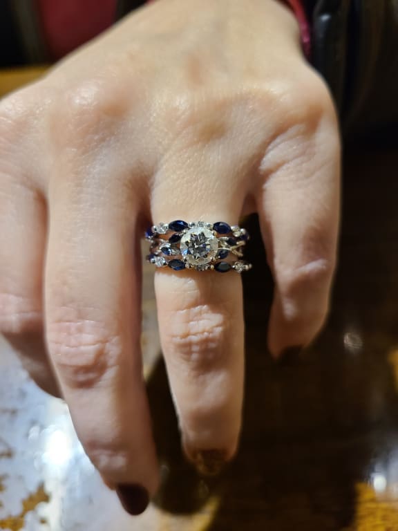 Oval diamond ring on hand