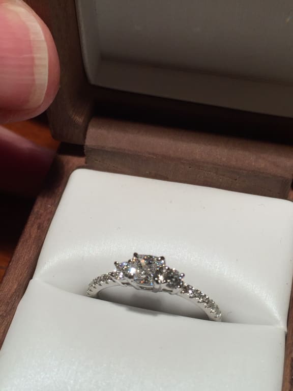 Oval diamond ring on hand