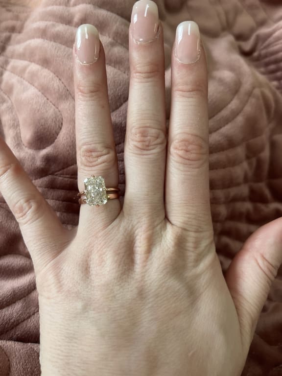 Oval diamond ring on hand
