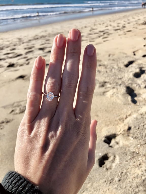 Oval diamond ring on hand