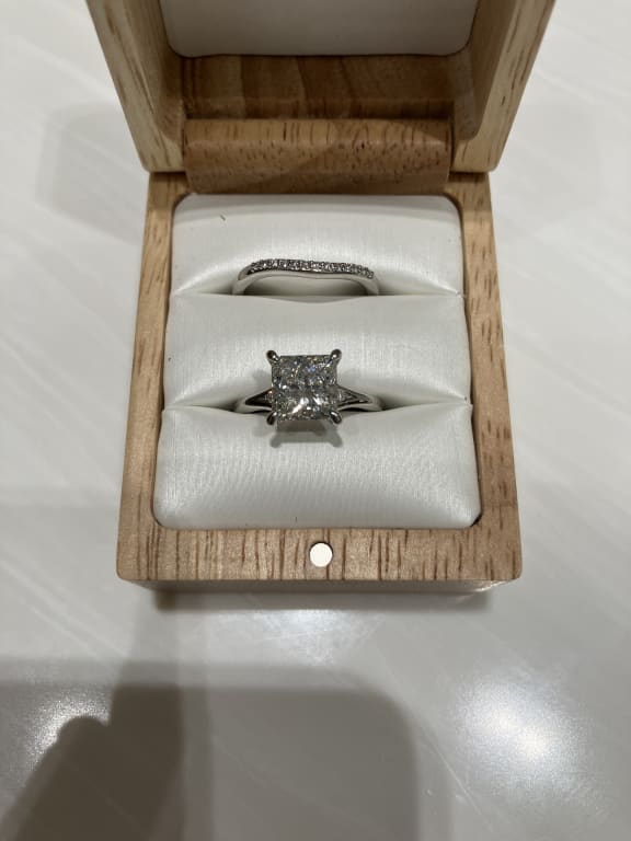 Oval diamond ring on hand